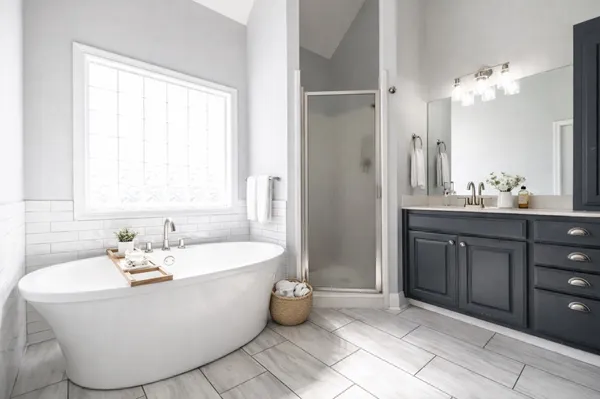 a spacious bathroom with a bathtub and sink
