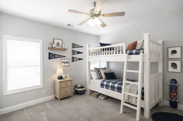 a bedroom with furniture and a window