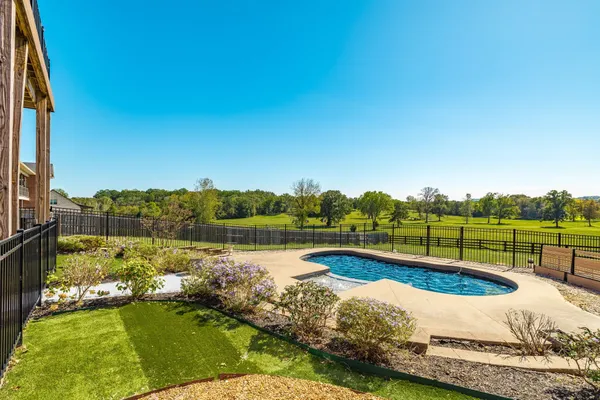 a view of a lake with a yard