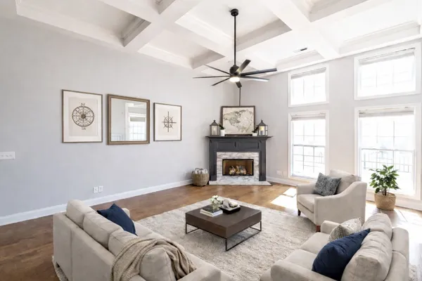 a living room with furniture and a fireplace