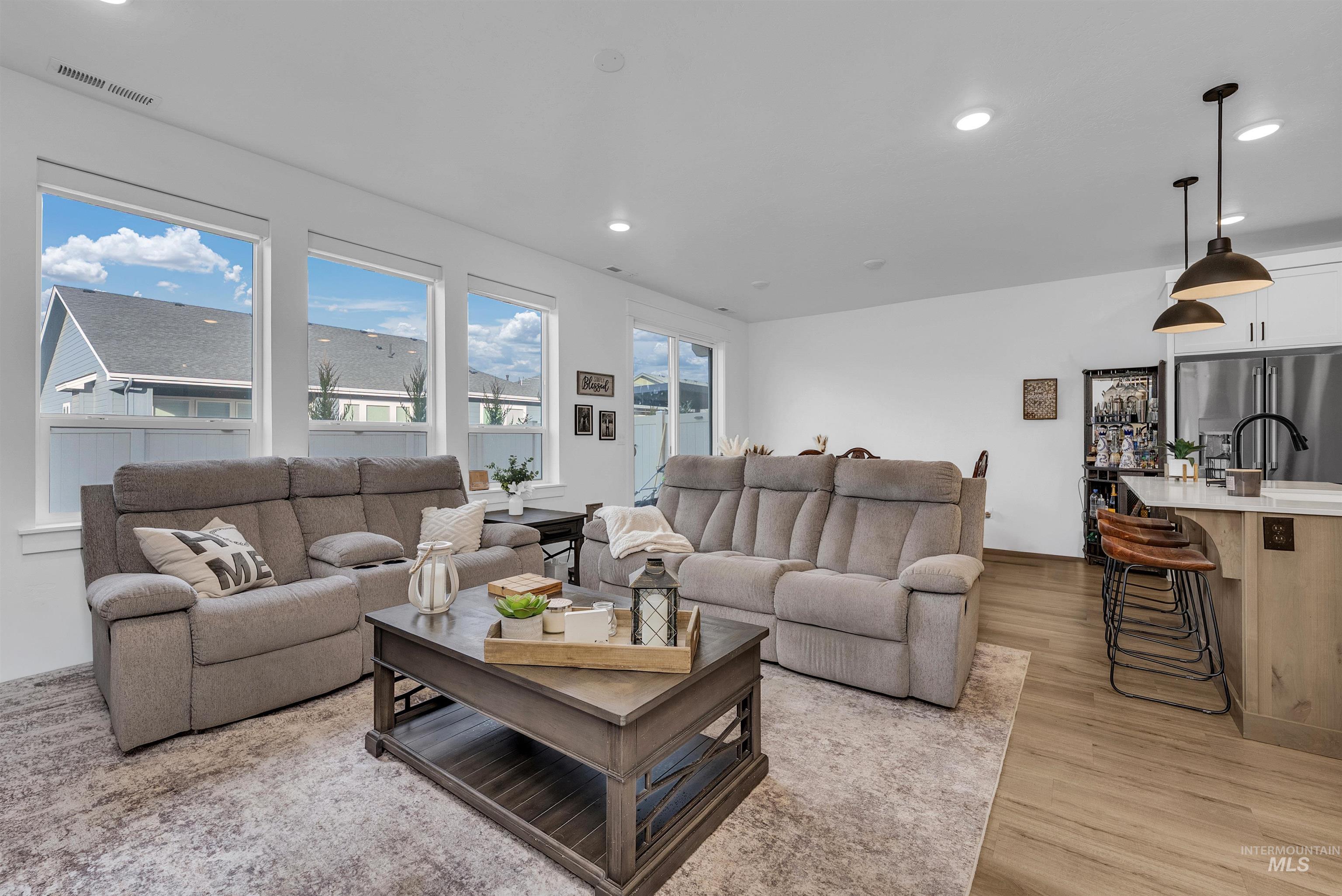 4678 West Riva Capri Street Meridian, ID 83646 - Photo 10 of 30 Living area featuring recessed lighting and light wood-type flooring