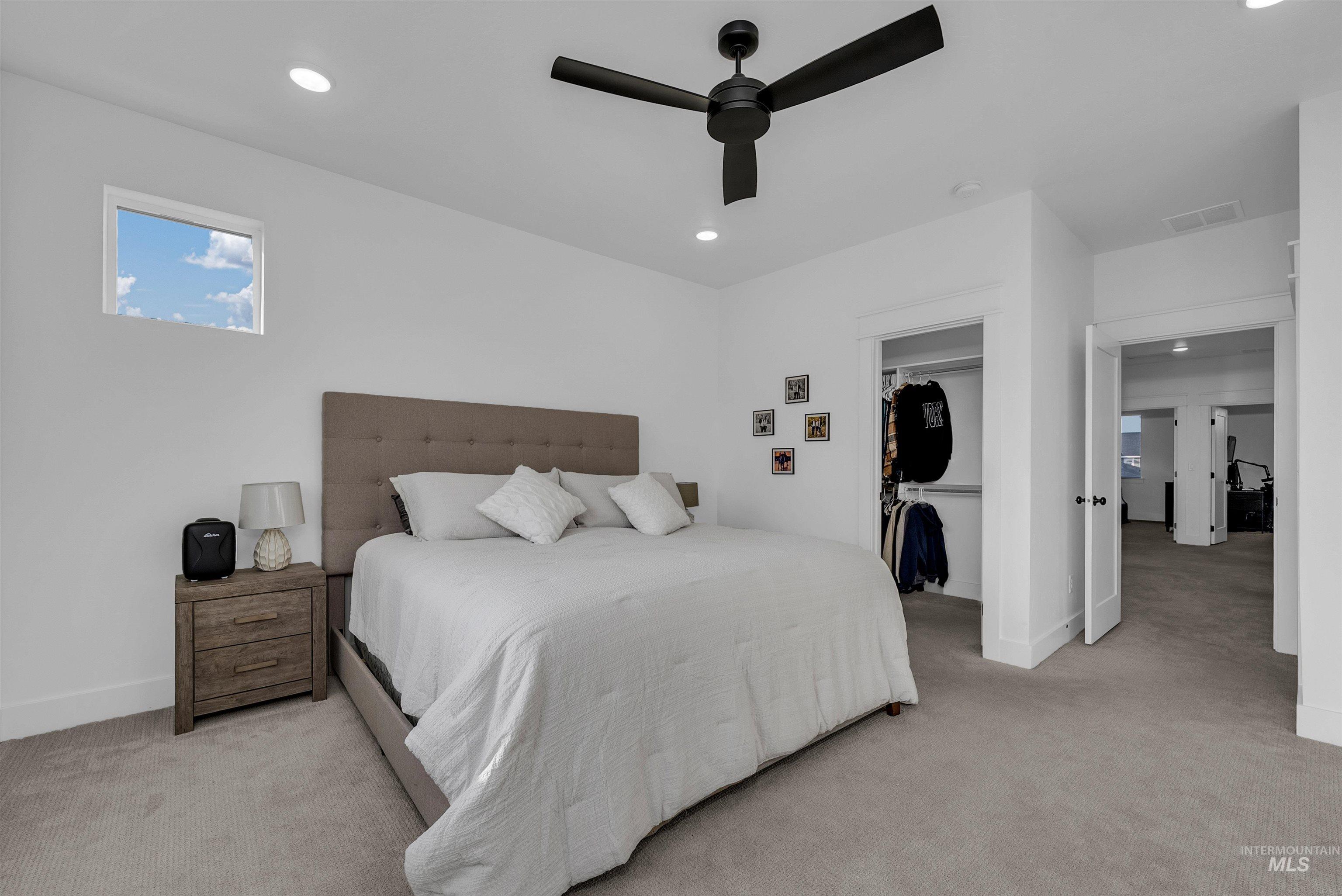 4678 West Riva Capri Street Meridian, ID 83646 - Photo 14 of 30 Bedroom with light carpet, recessed lighting, a ceiling fan, and a spacious closet