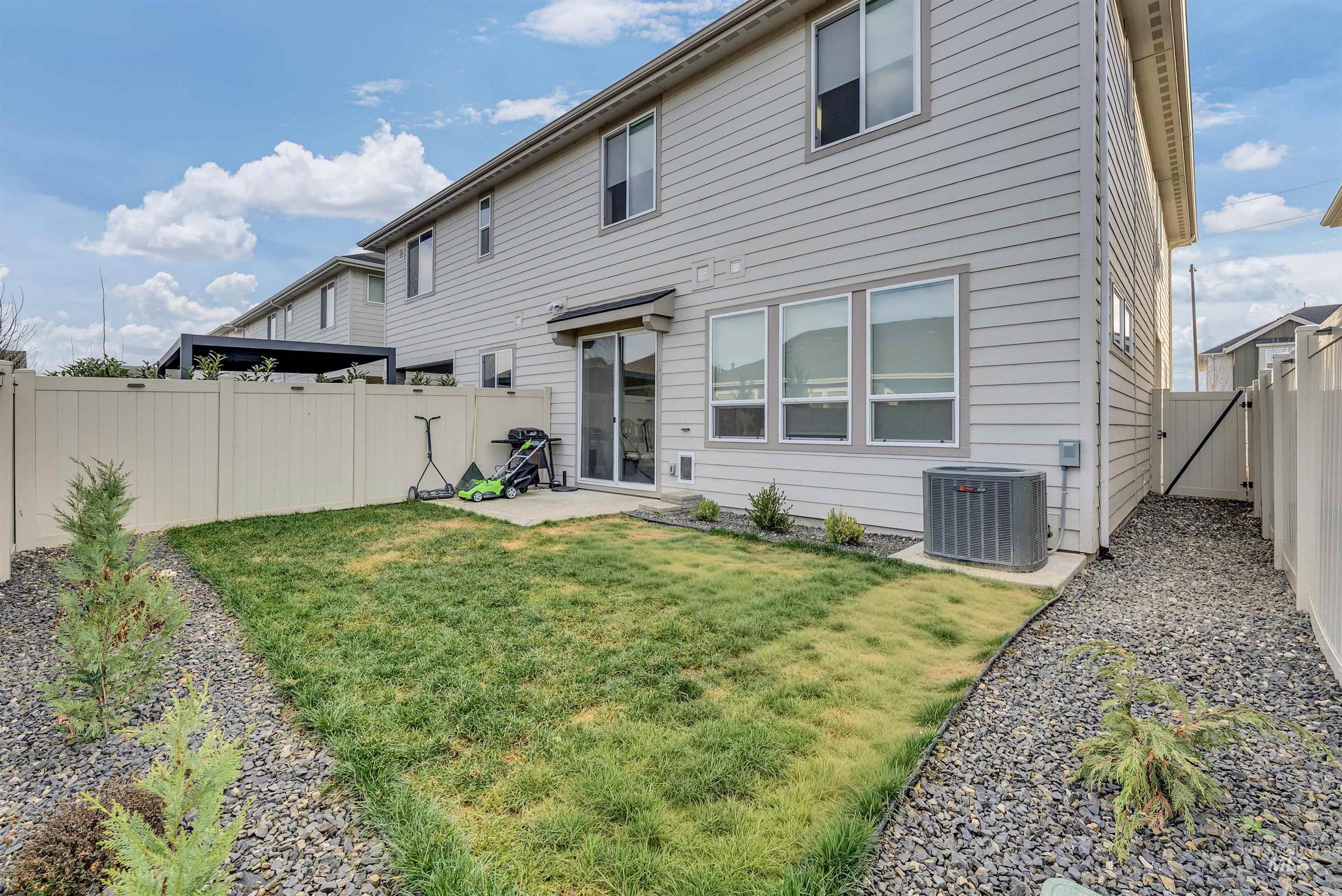 4678 West Riva Capri Street Meridian, ID 83646 - Photo 26 of 30 Rear view of house featuring a patio area and a fenced backyard
