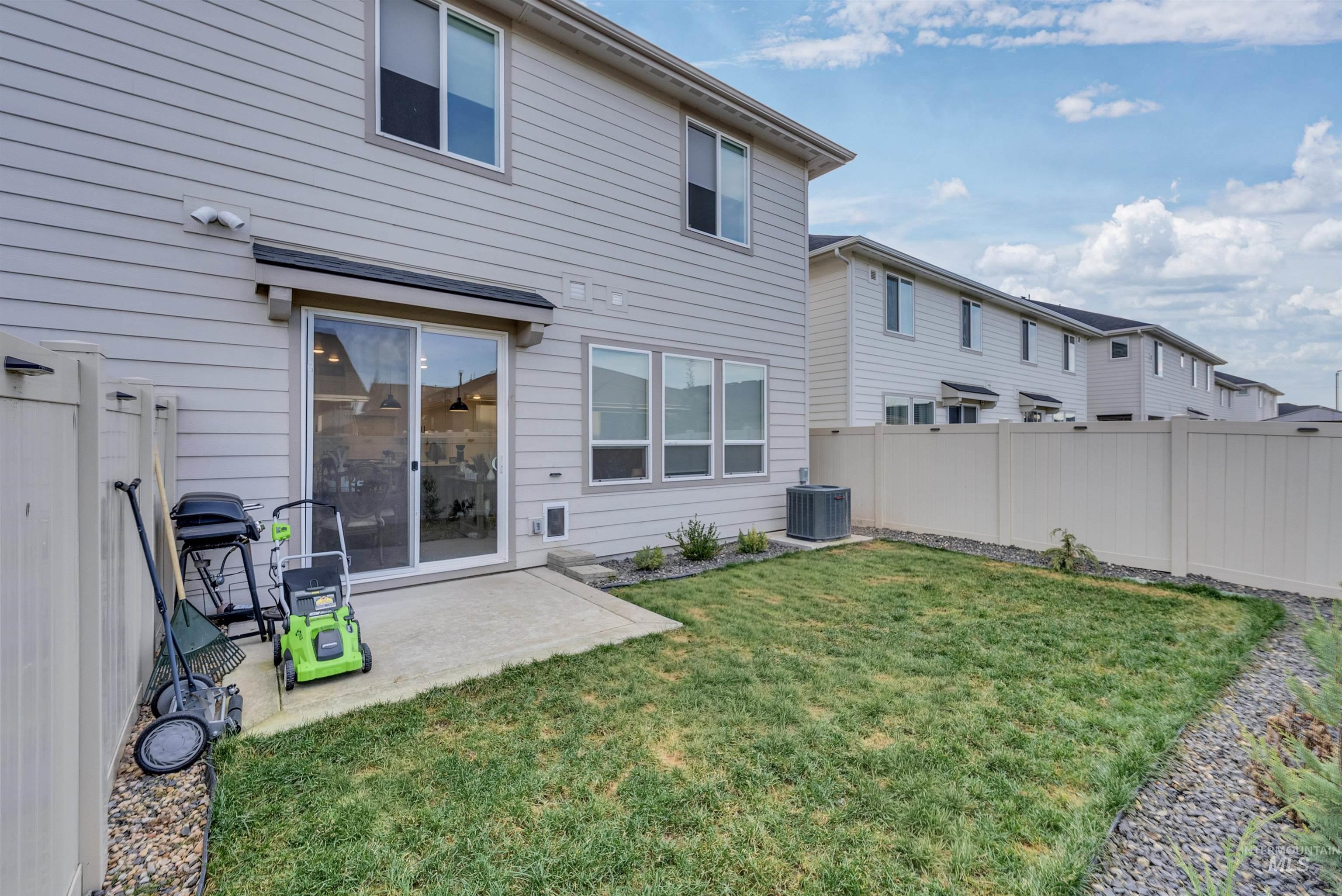 4678 West Riva Capri Street Meridian, ID 83646 - Photo 27 of 30 Rear view of property featuring a patio