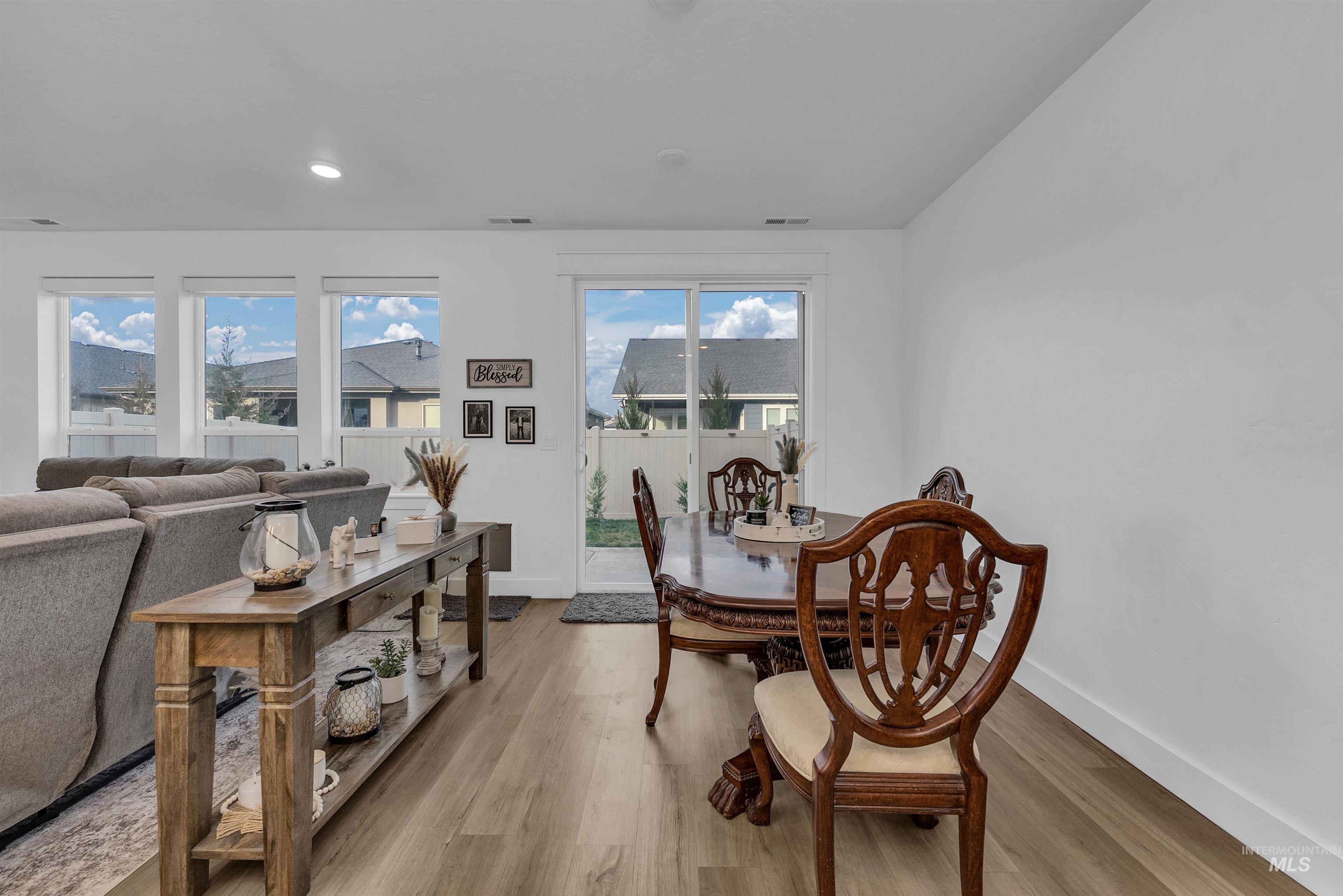 4678 West Riva Capri Street Meridian, ID 83646 - Photo 8 of 30 Dining room with wood finished floors, plenty of natural light, and recessed lighting