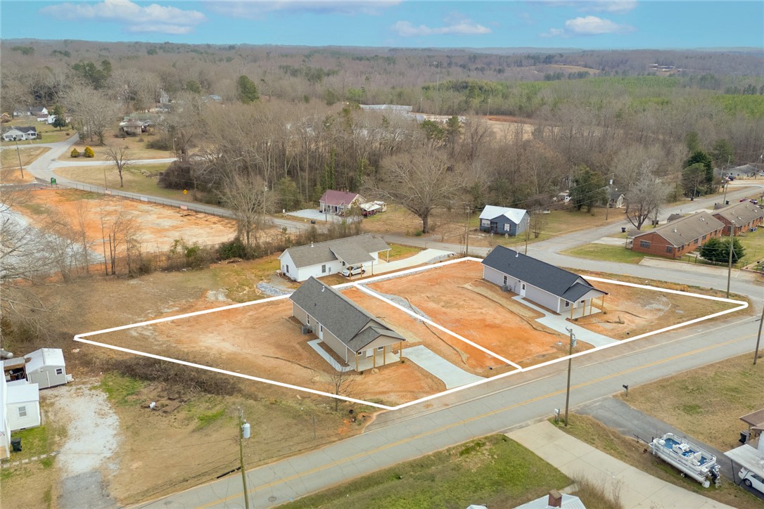 115 Riley Street Westminster, SC 29693 - Photo 32 of 46 This aerial view showcases a lot ready for development, offering a blank canvas for future construction.