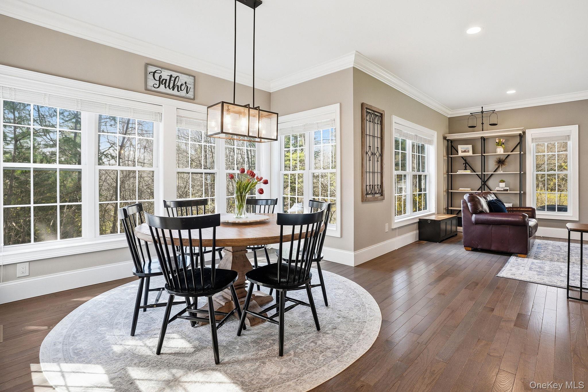 19 Lillian Road Mahopac, NY 10541 - Photo 12 of 50 Dining space featuring crown molding, dark wood-type flooring, and recessed lighting