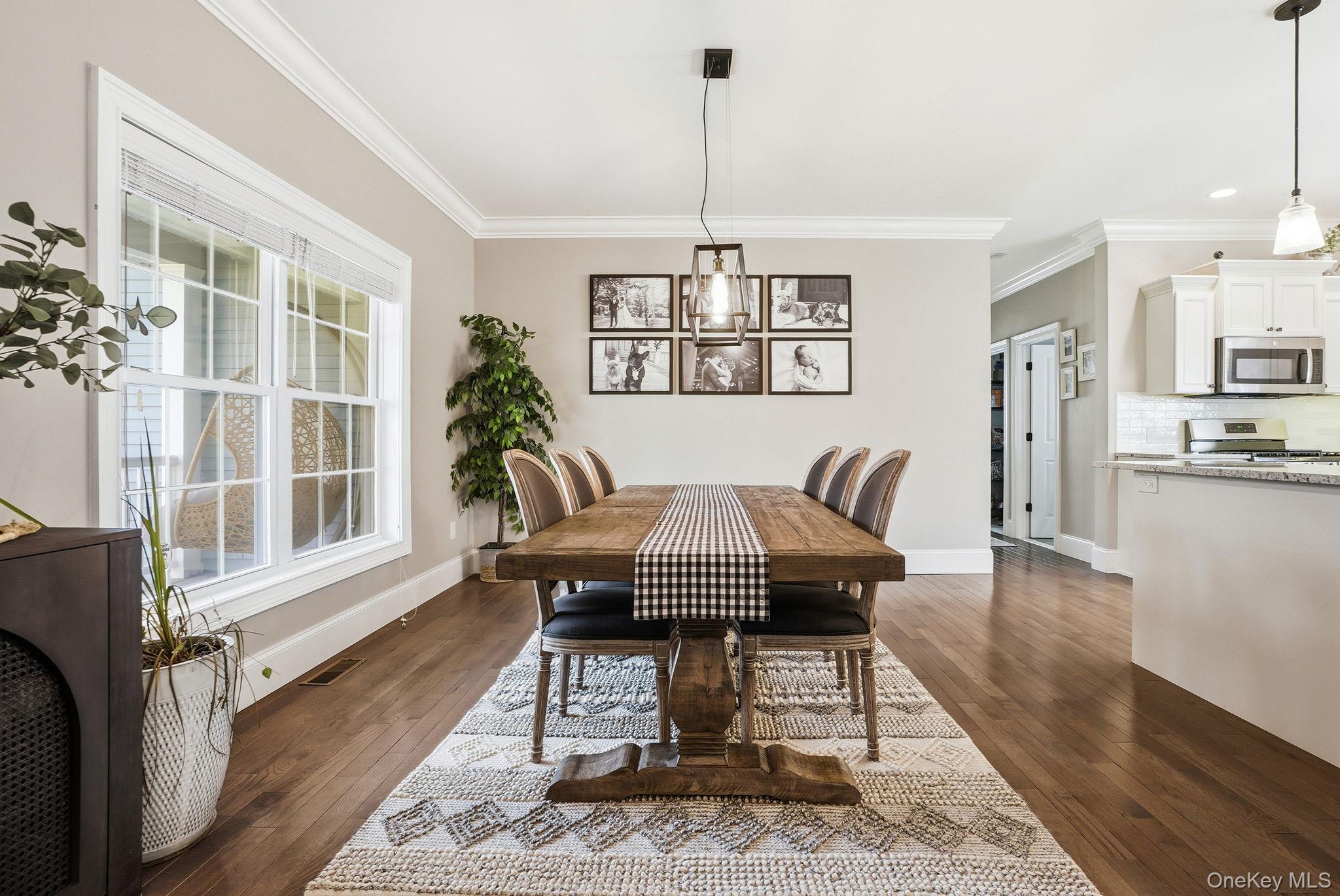 19 Lillian Road Mahopac, NY 10541 - Photo 14 of 50 Dining room with ornamental molding and dark wood-style floors