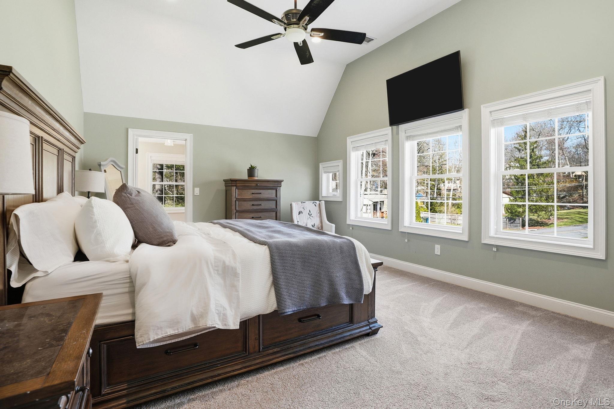 19 Lillian Road Mahopac, NY 10541 - Photo 22 of 50 Bedroom featuring light carpet, ceiling fan, and vaulted ceiling