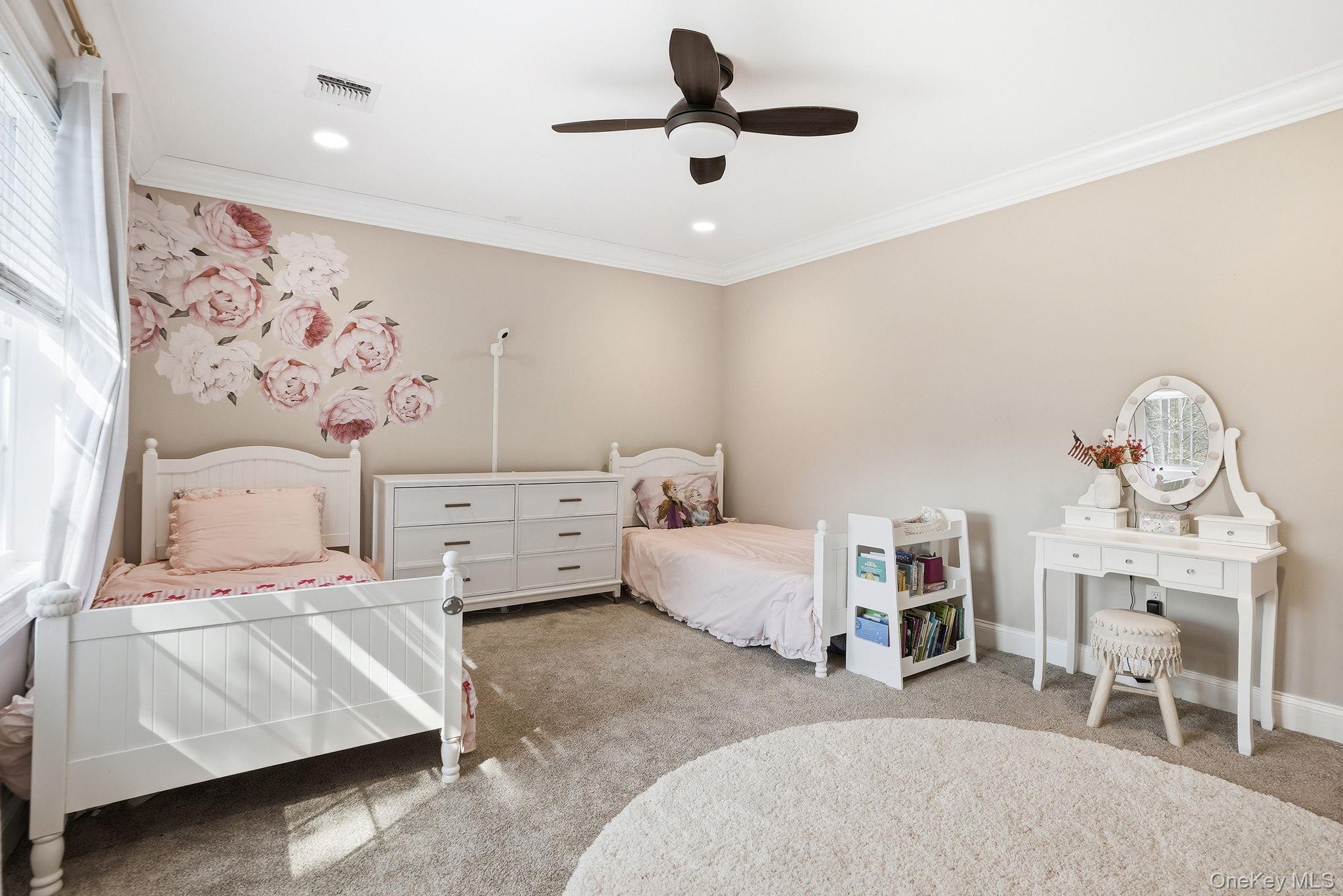 19 Lillian Road Mahopac, NY 10541 - Photo 26 of 50 Bedroom featuring carpet flooring, a ceiling fan, and ornamental molding