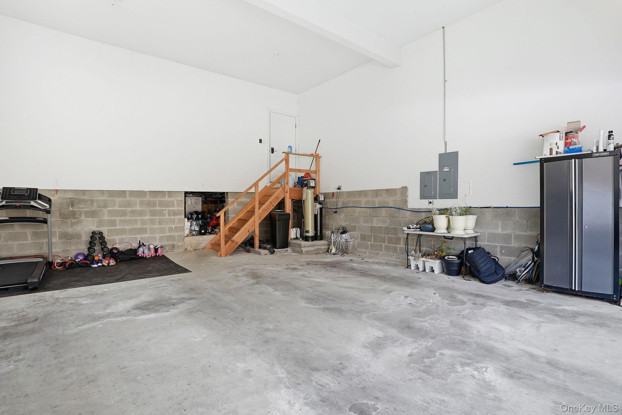 19 Lillian Road Mahopac, NY 10541 - Photo 37 of 50 Garage featuring concrete block wall and electric panel