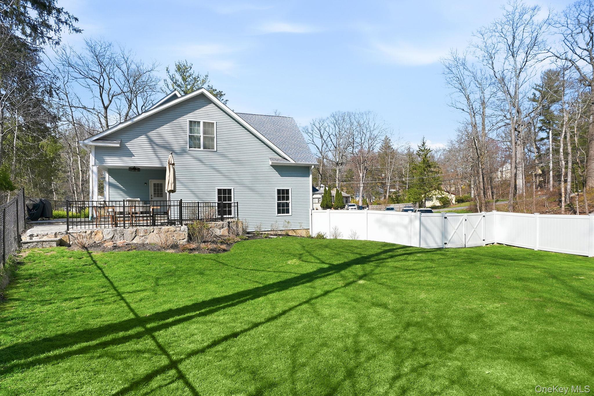 19 Lillian Road Mahopac, NY 10541 - Photo 44 of 50 Rear view of house featuring a fenced backyard, a patio, and a gate