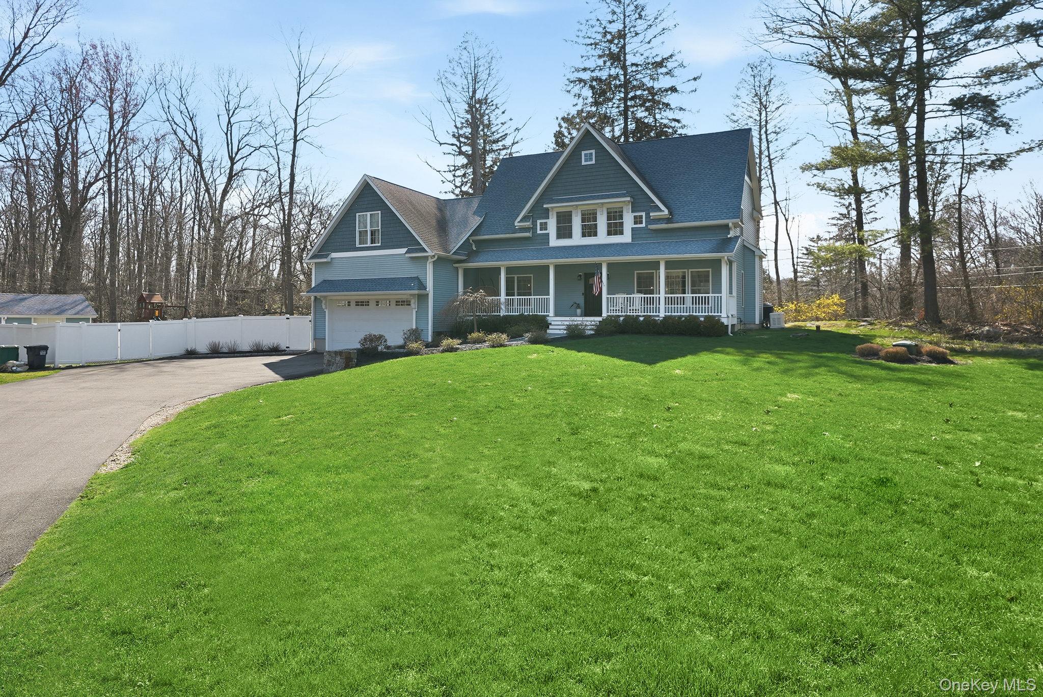 19 Lillian Road Mahopac, NY 10541 - Photo 47 of 50 View of front of property with covered porch and asphalt driveway
