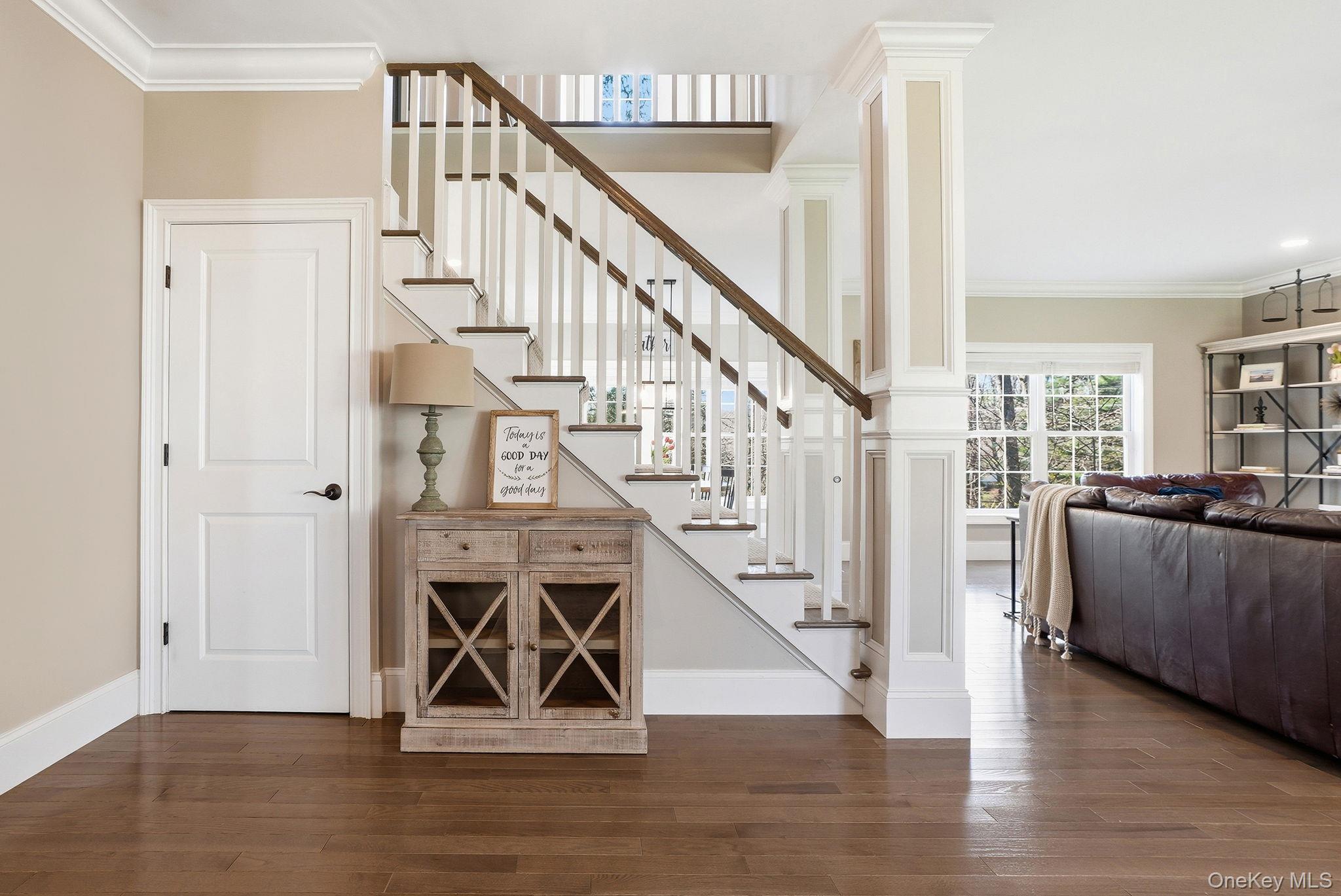 19 Lillian Road Mahopac, NY 10541 - Photo 7 of 50 Stairway featuring ornamental molding, ornate columns, and wood-type flooring