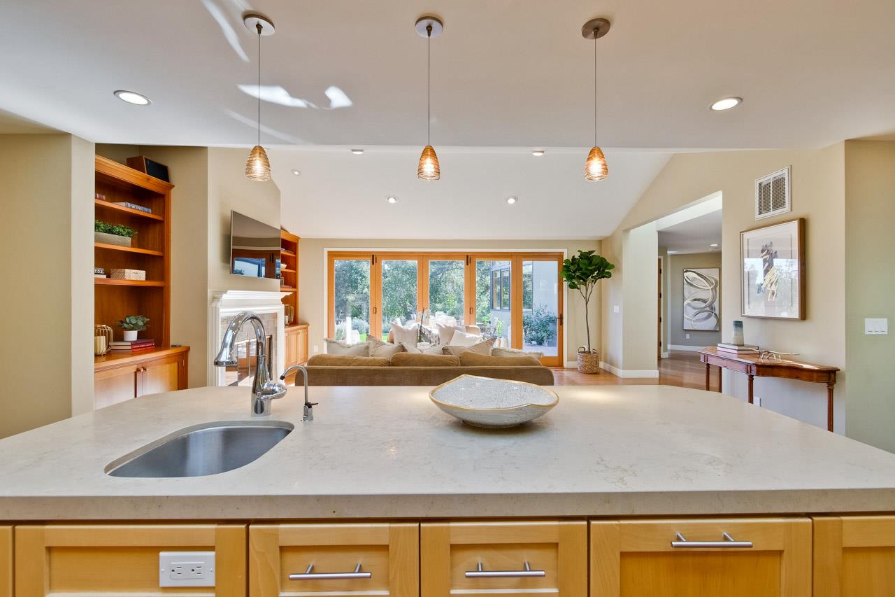 10551 Magdalena Road Los Altos Hills, CA 94024 - Photo 11 of 45 a kitchen with a sink a stove and chairs