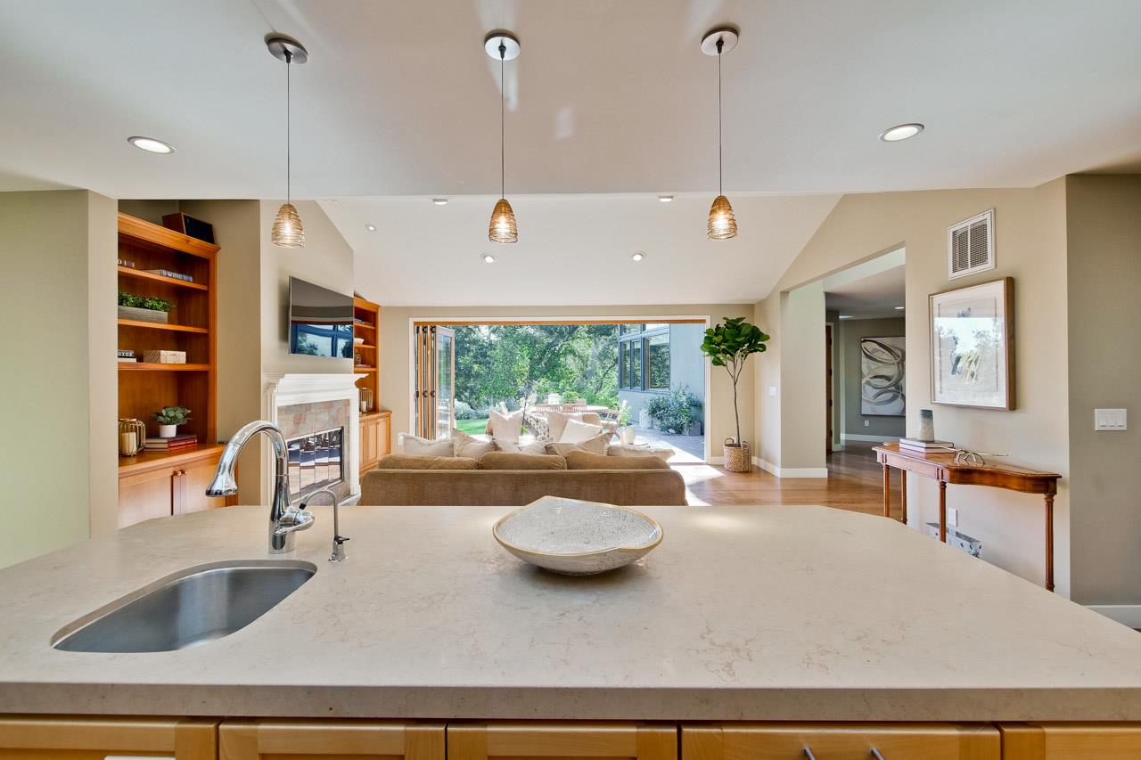 10551 Magdalena Road Los Altos Hills, CA 94024 - Photo 14 of 45 a kitchen with a sink a counter top space and living room view