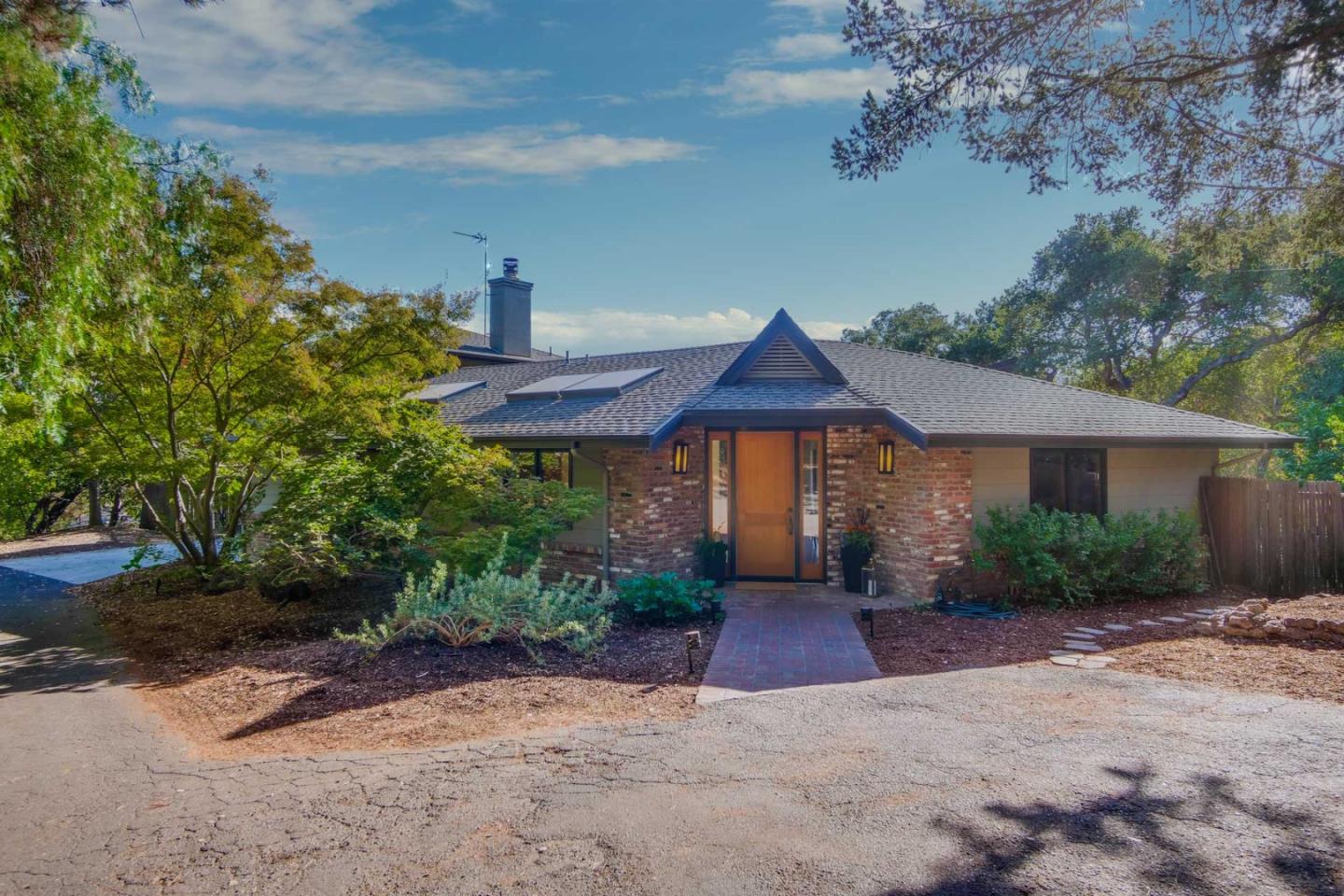 10551 Magdalena Road Los Altos Hills, CA 94024 - Photo 3 of 45 a front view of a house with a yard