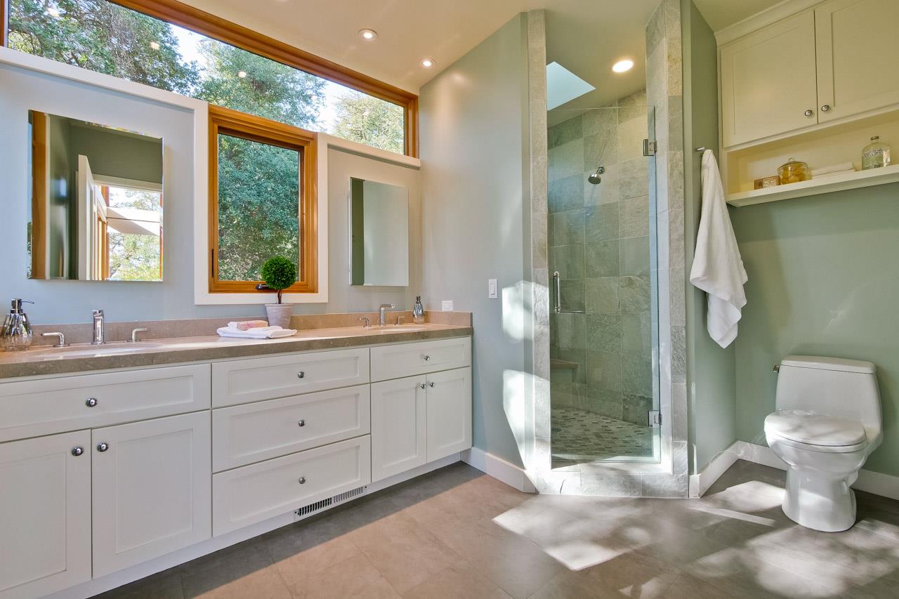 10551 Magdalena Road Los Altos Hills, CA 94024 - Photo 24 of 45 a spacious bathroom with a double vanity sink toilet and shower
