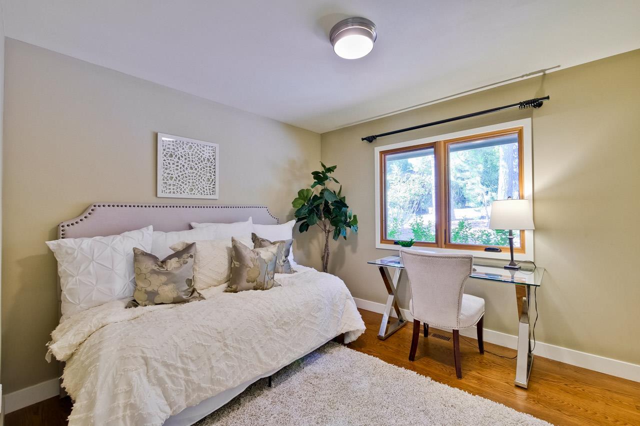 10551 Magdalena Road Los Altos Hills, CA 94024 - Photo 27 of 45 a bedroom with a bed and a table