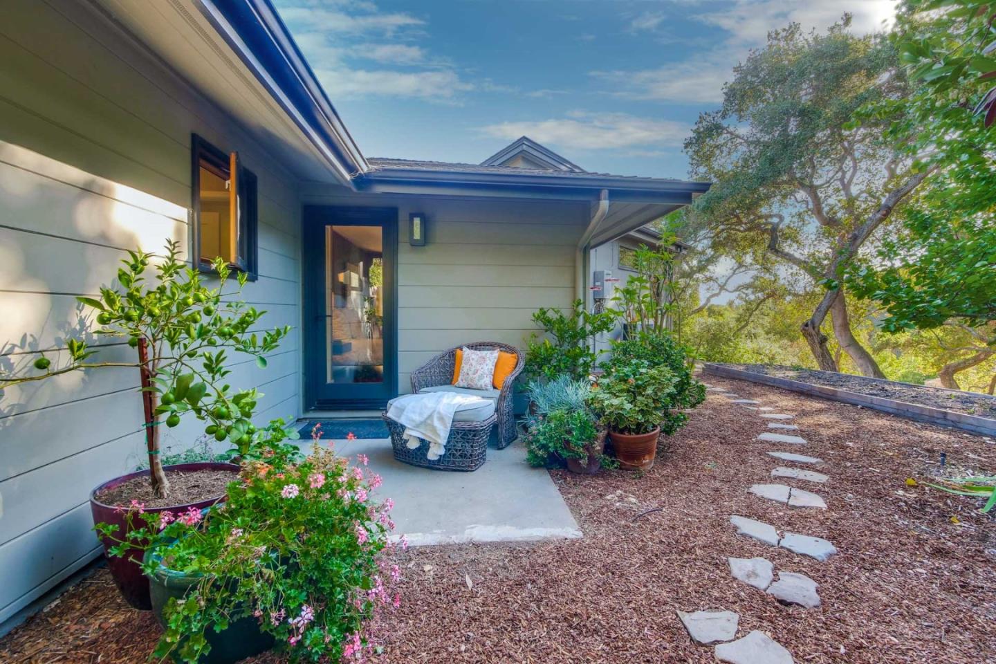 10551 Magdalena Road Los Altos Hills, CA 94024 - Photo 34 of 45 a front view of a house with outdoor seating