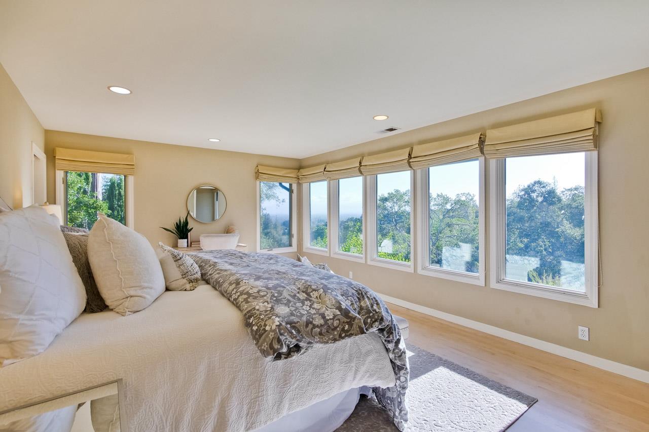 10551 Magdalena Road Los Altos Hills, CA 94024 - Photo 36 of 45 a bedroom with a large bed and a large window