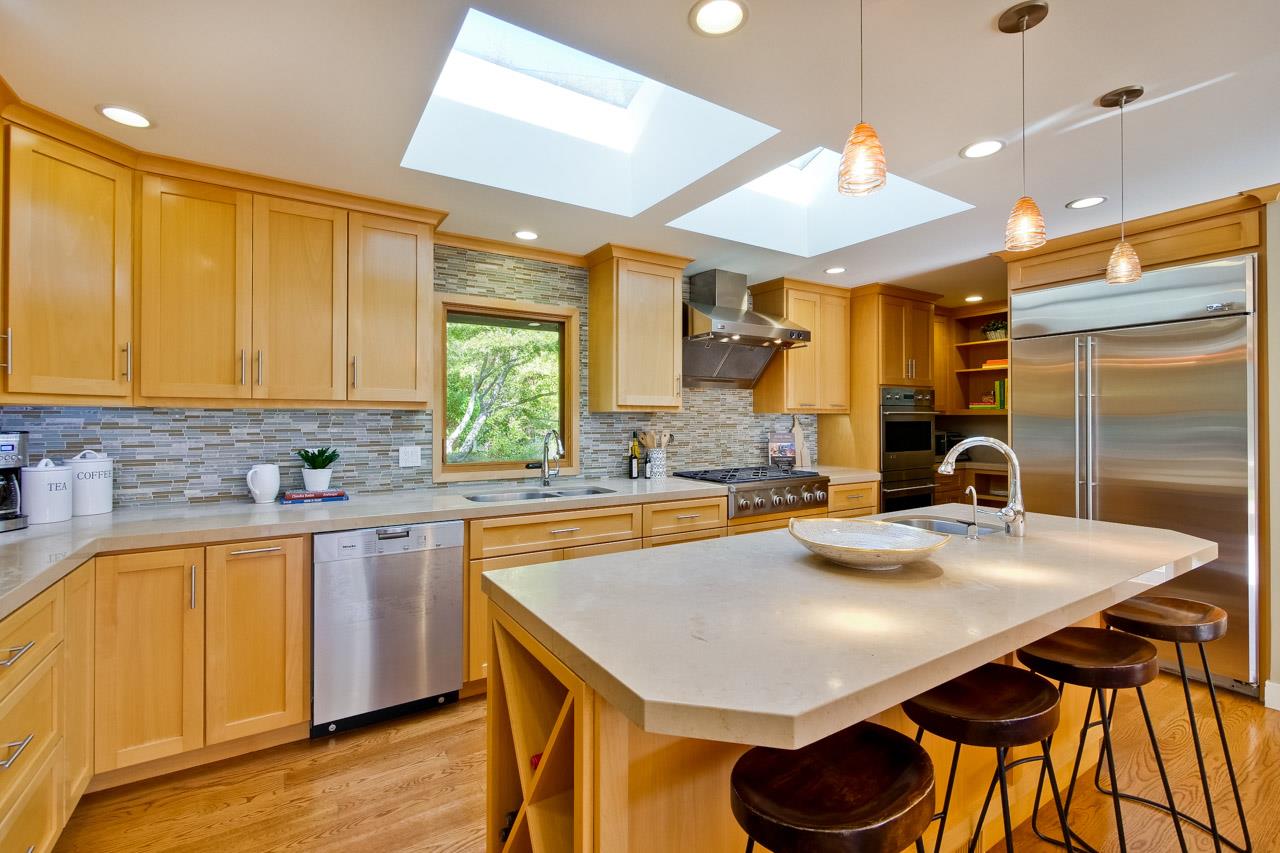 10551 Magdalena Road Los Altos Hills, CA 94024 - Photo 9 of 45 a kitchen with stainless steel appliances granite countertop a sink a stove and a refrigerator with wooden floor