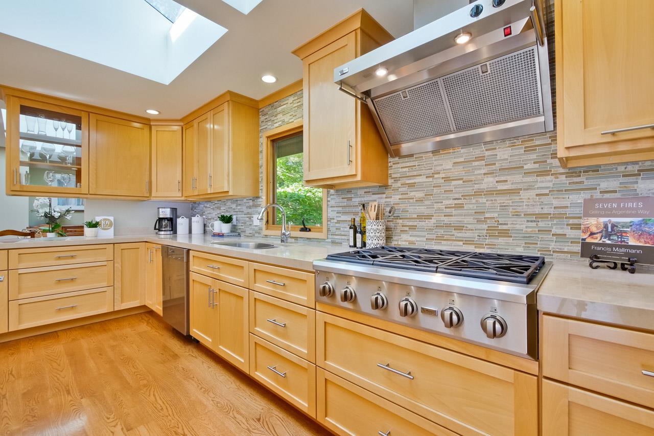 10551 Magdalena Road Los Altos Hills, CA 94024 - Photo 10 of 45 a kitchen with stainless steel appliances granite countertop a stove and a sink