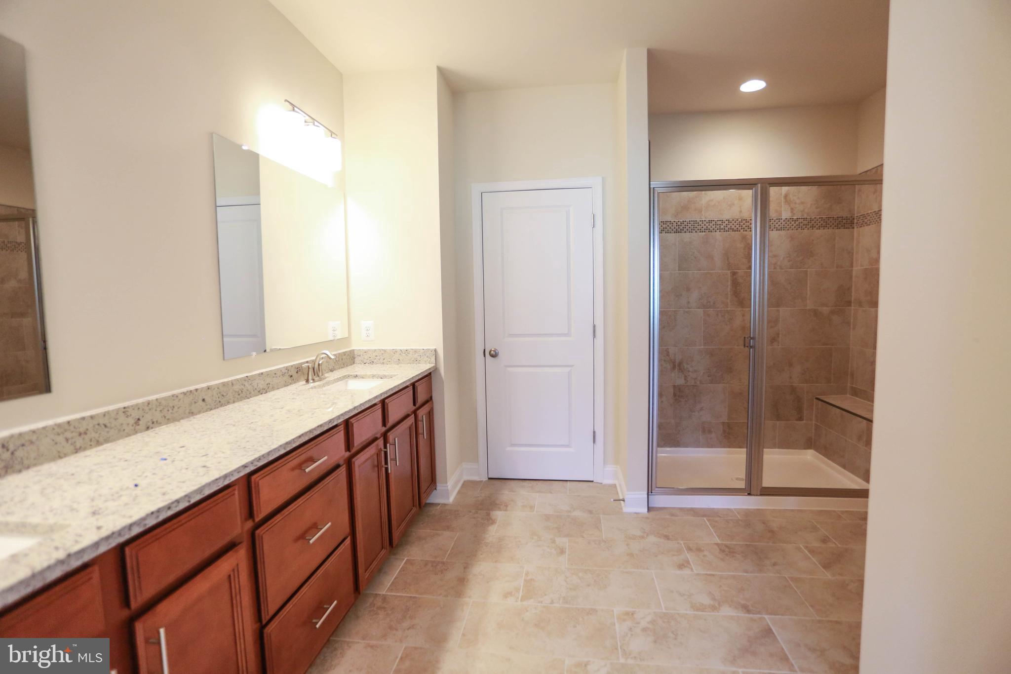 7142 Proclamation Place Frederick, MD 21703 - Photo 21 of 42 Master Bathroom with Shower & Dual Sink Vanity