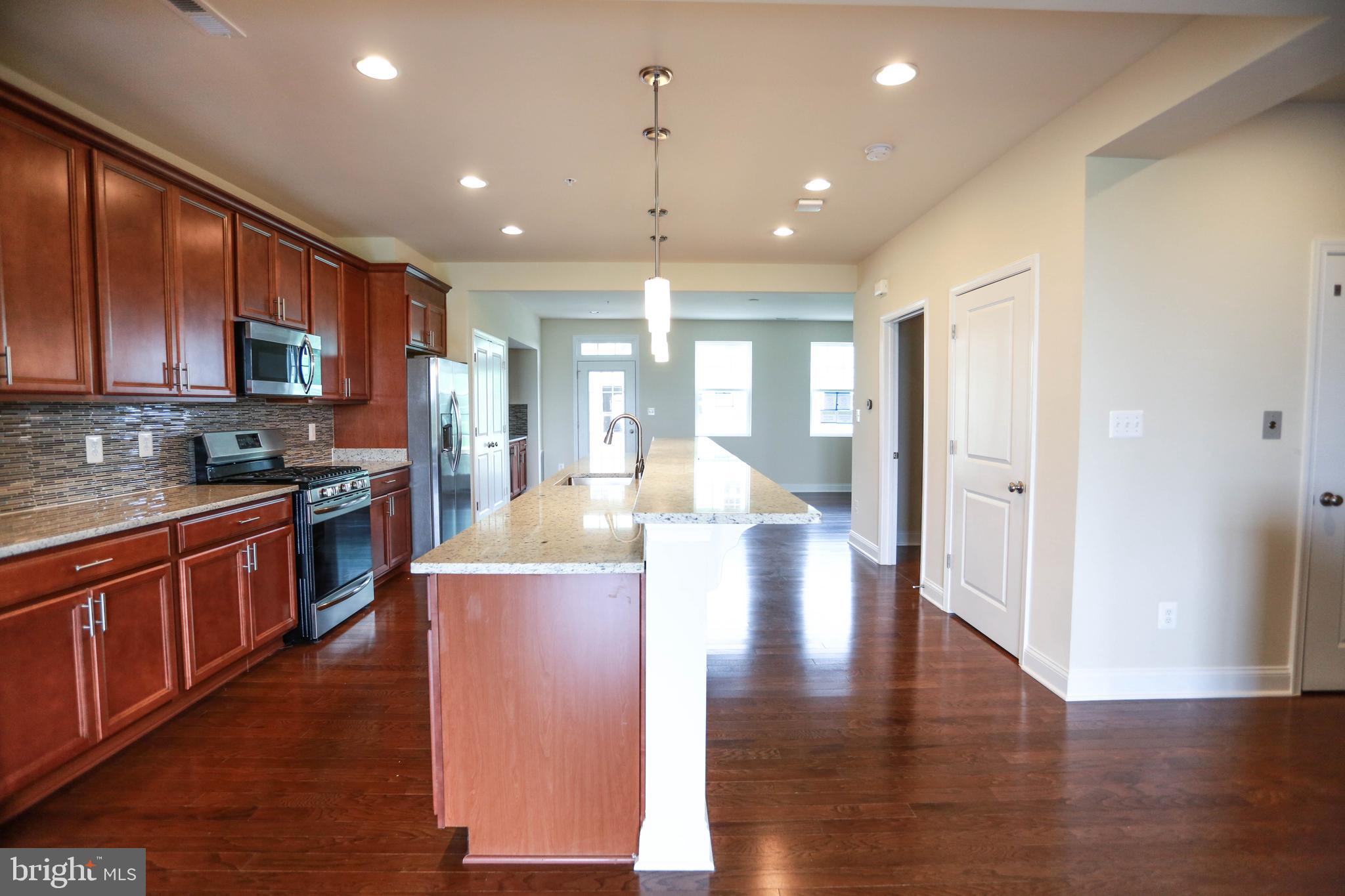 7142 Proclamation Place Frederick, MD 21703 - Photo 9 of 42 Gourmet Kitchen w/ Granite & SS Appliances