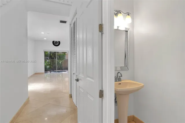 a bathroom with a sink and shower
