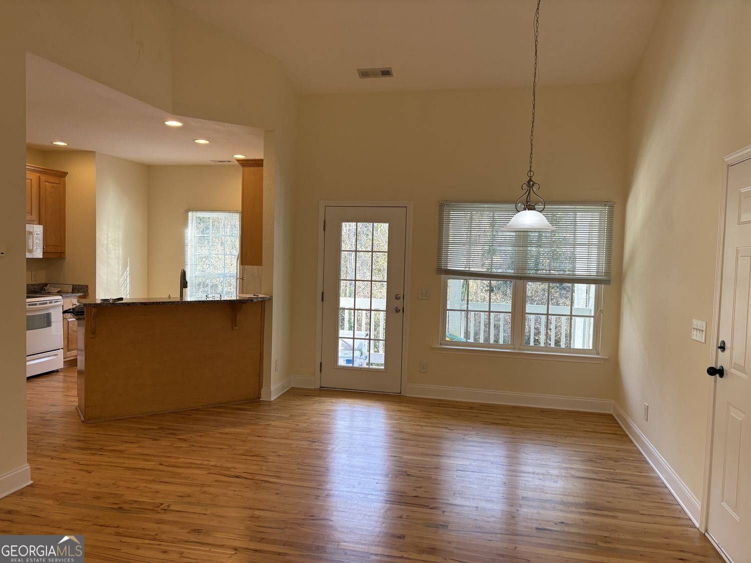 74 Lockerbie Court, Unit 202 Clayton, GA 30525 - Photo 5 of 23 dining to front porch.jpg
