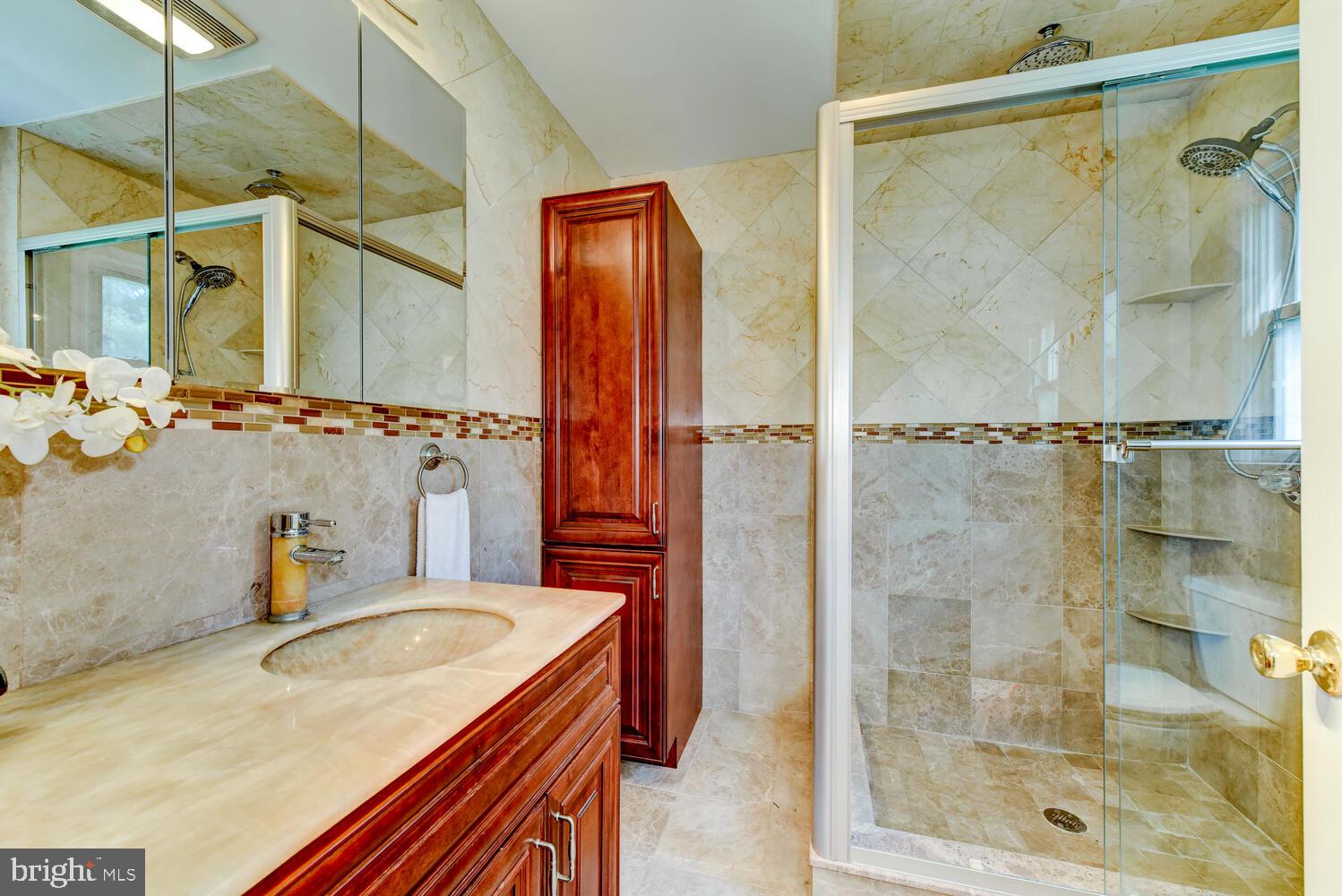 5 Glengarry Way Princeton Junction, NJ 08550 - Photo 36 of 63 a bathroom with a granite countertop shower sink and mirror
