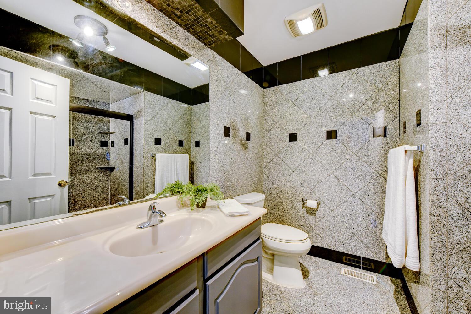 5 Glengarry Way Princeton Junction, NJ 08550 - Photo 40 of 63 a bathroom with a sink a toilet and shower