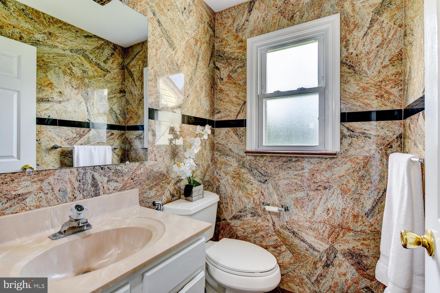 5 Glengarry Way Princeton Junction, NJ 08550 - Photo 42 of 63 a bathroom with a sink toilet a mirror and shower