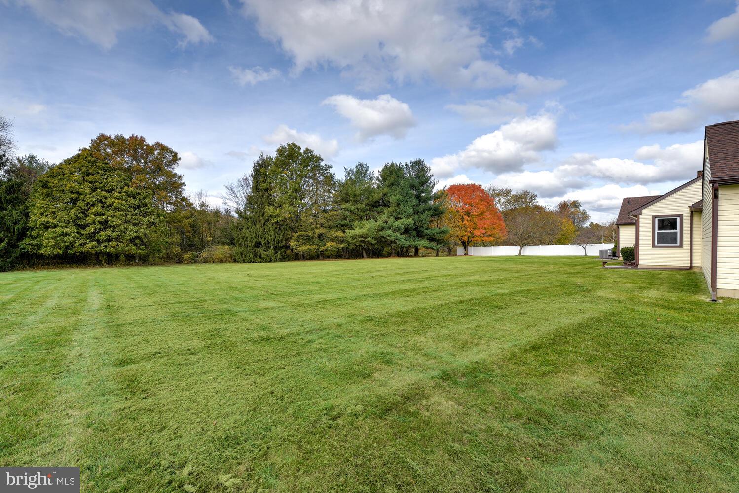 5 Glengarry Way Princeton Junction, NJ 08550 - Photo 55 of 63 a view of a green field with wooden fence