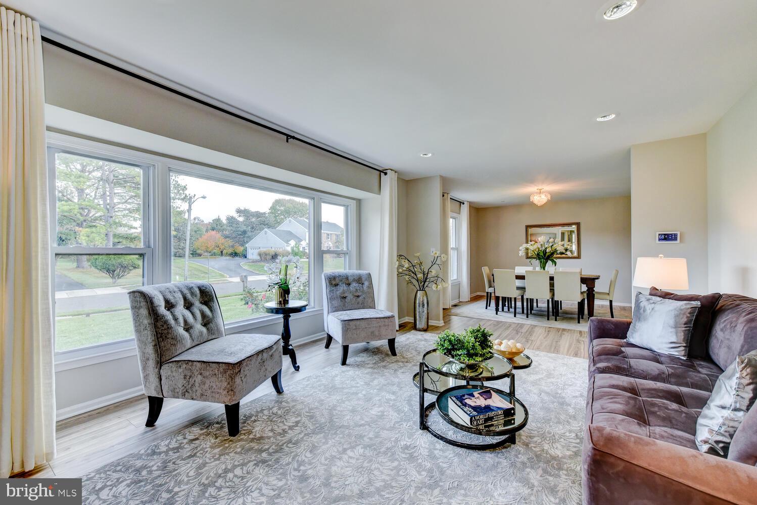 5 Glengarry Way Princeton Junction, NJ 08550 - Photo 9 of 63 a living room with furniture and a large window