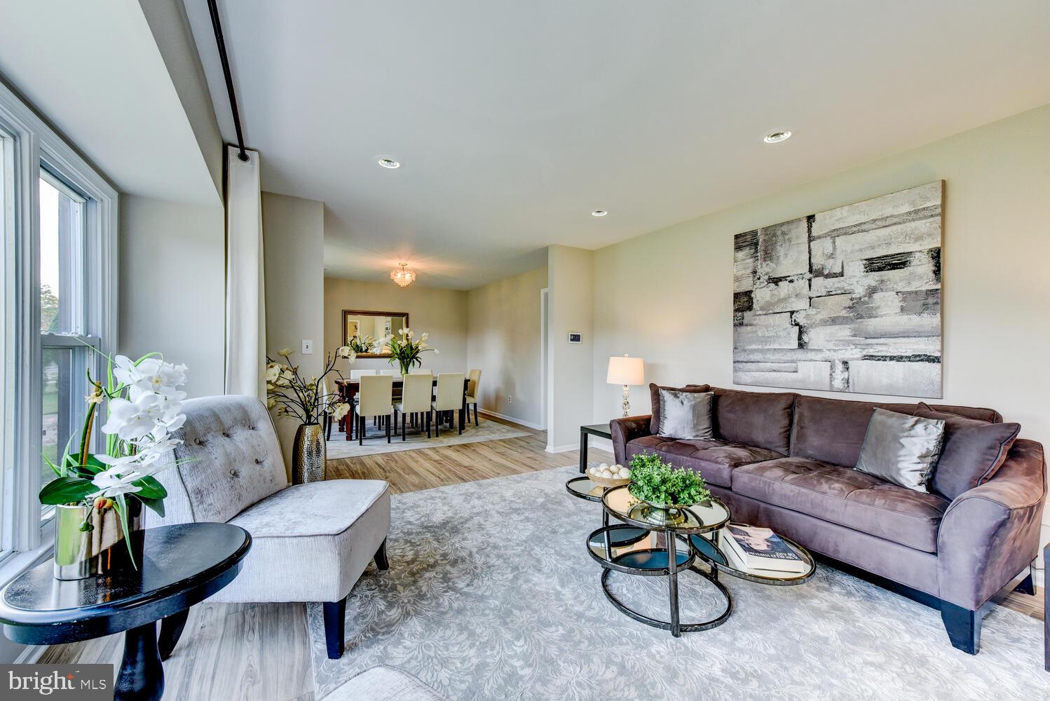 5 Glengarry Way Princeton Junction, NJ 08550 - Photo 10 of 63 a living room with furniture and a chandelier