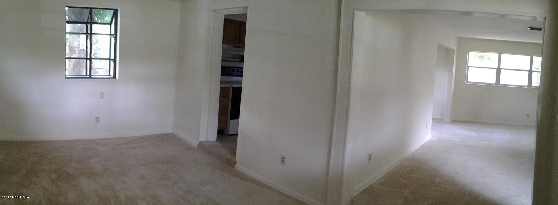 2131 Goltare Drive Jacksonville, FL 32216 - Photo 7 of 25 an empty room with windows