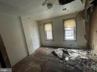 1108 West 3rd Street Chester, PA 19013 - Photo 57 of 75 a bed room with a bed and a window