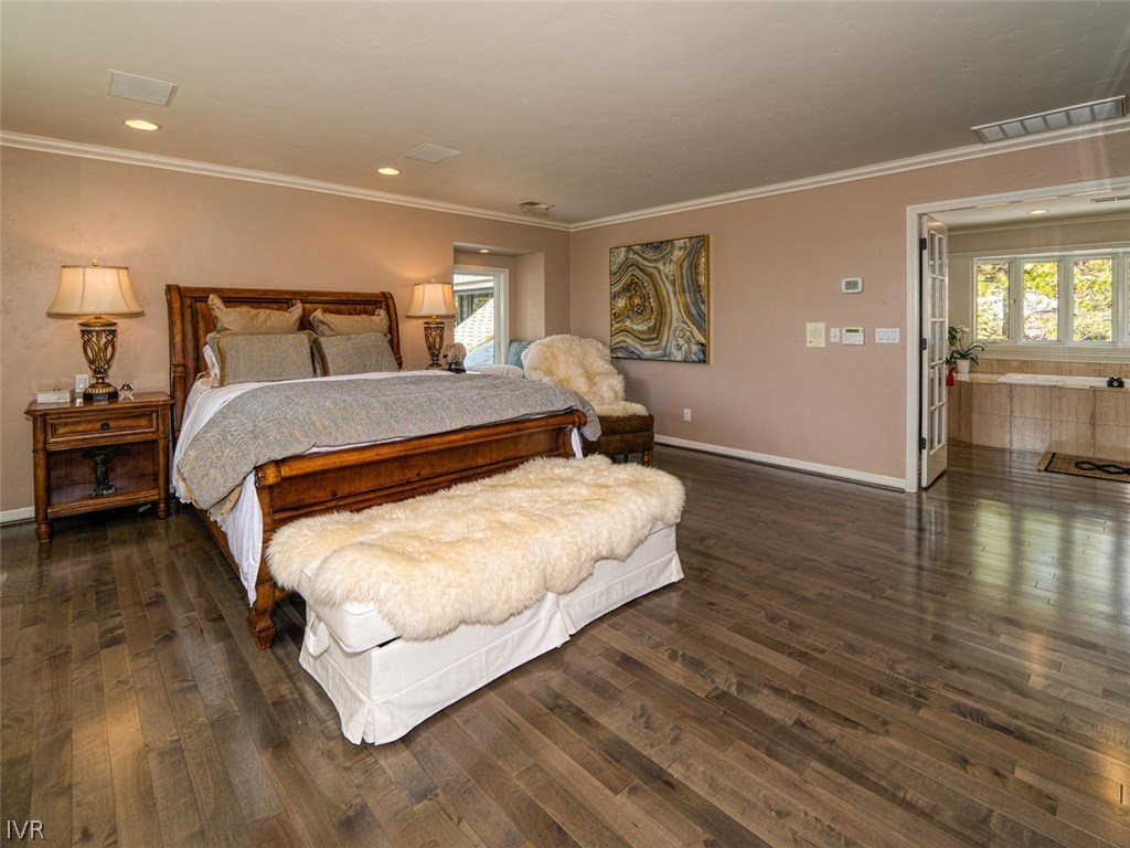714 Champagne Road Incline Village, NV 89451 - Photo 13 of 29 a bedroom with a bed and wooden floor