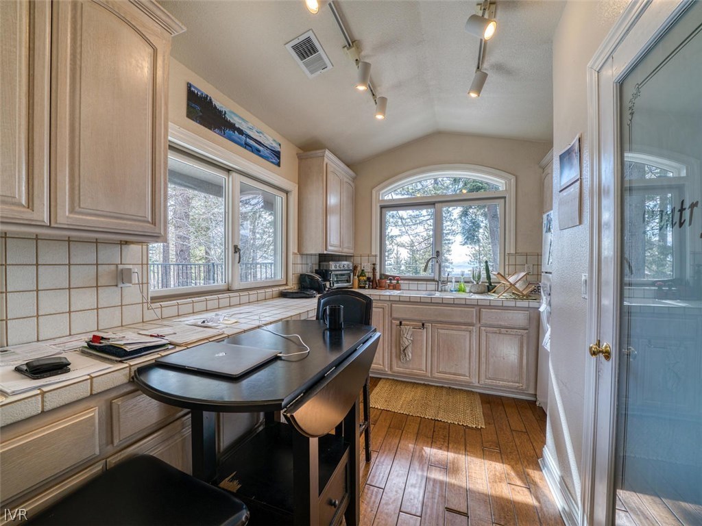 714 Champagne Road Incline Village, NV 89451 - Photo 18 of 29 a kitchen with sink cabinets and dining table chair