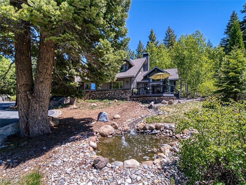 714 Champagne Road Incline Village, NV 89451 - Photo 25 of 29 a front view of a house with a yard covered with trees