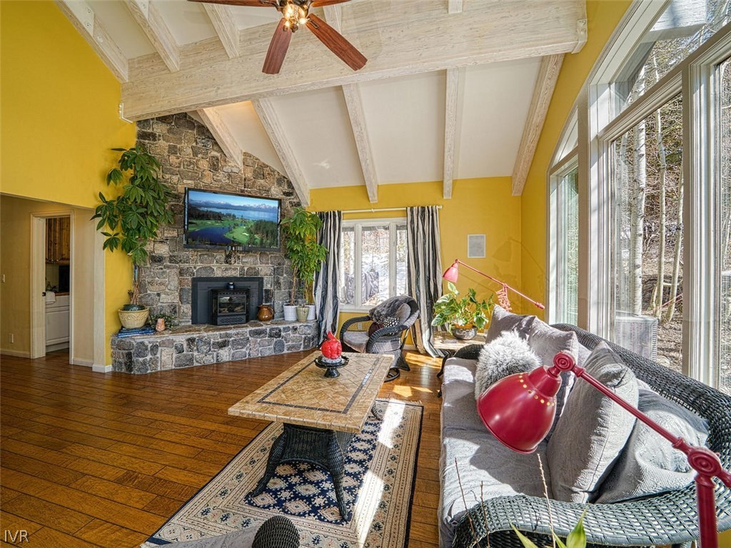 714 Champagne Road Incline Village, NV 89451 - Photo 8 of 29 a living room with furniture a fireplace and a floor to ceiling window