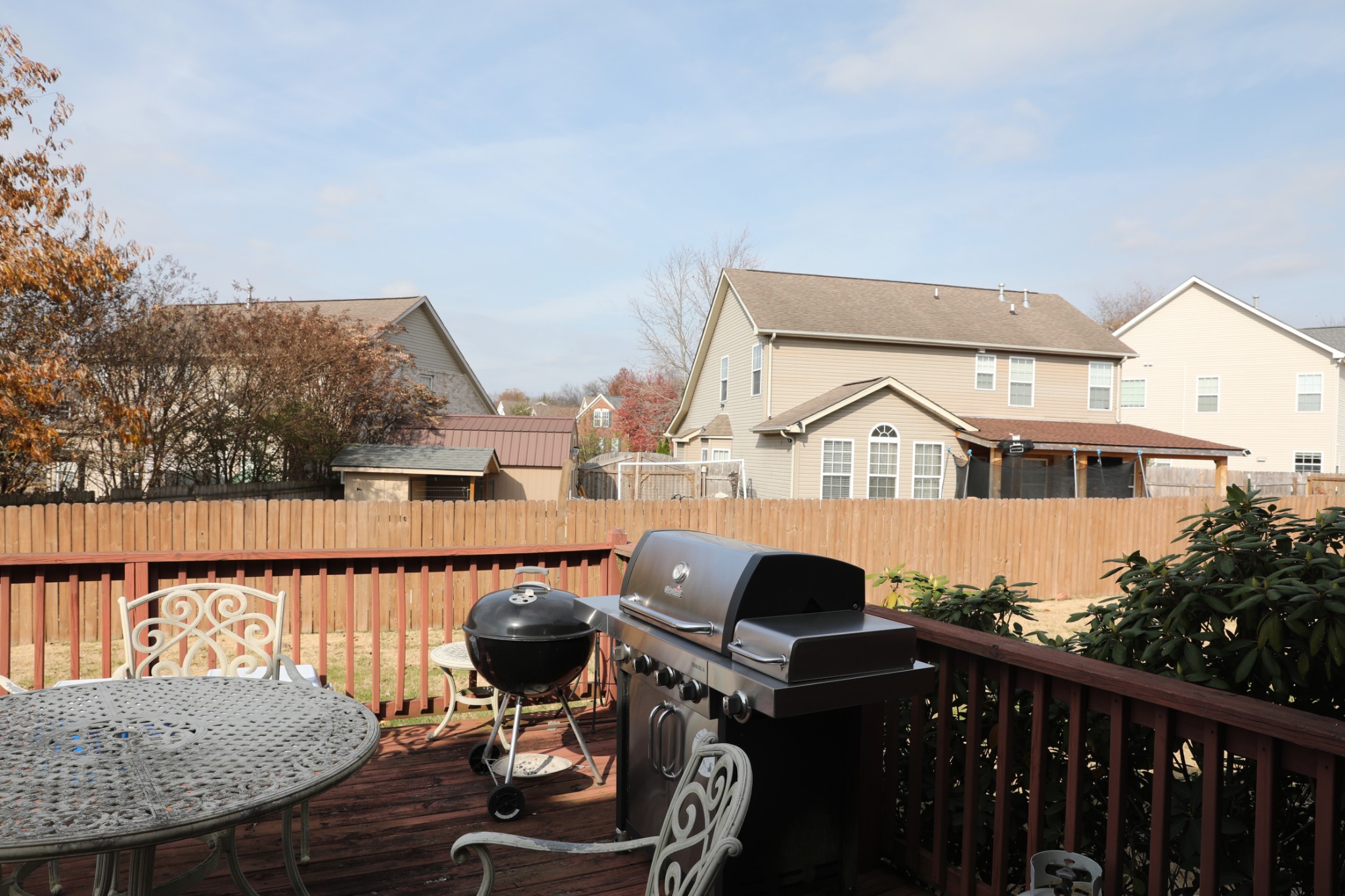 1019 Queens Place Spring Hill, TN 37174 - Photo 18 of 18 a view of a balcony with two chairs and a table