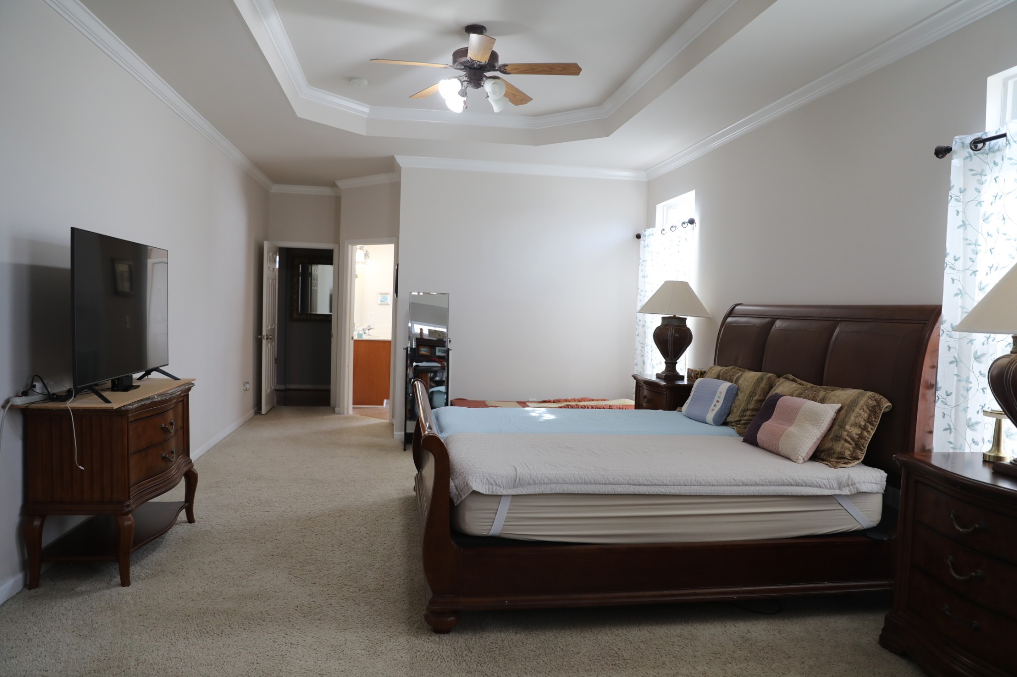 1019 Queens Place Spring Hill, TN 37174 - Photo 10 of 18 a bedroom with a bed and a flat screen tv