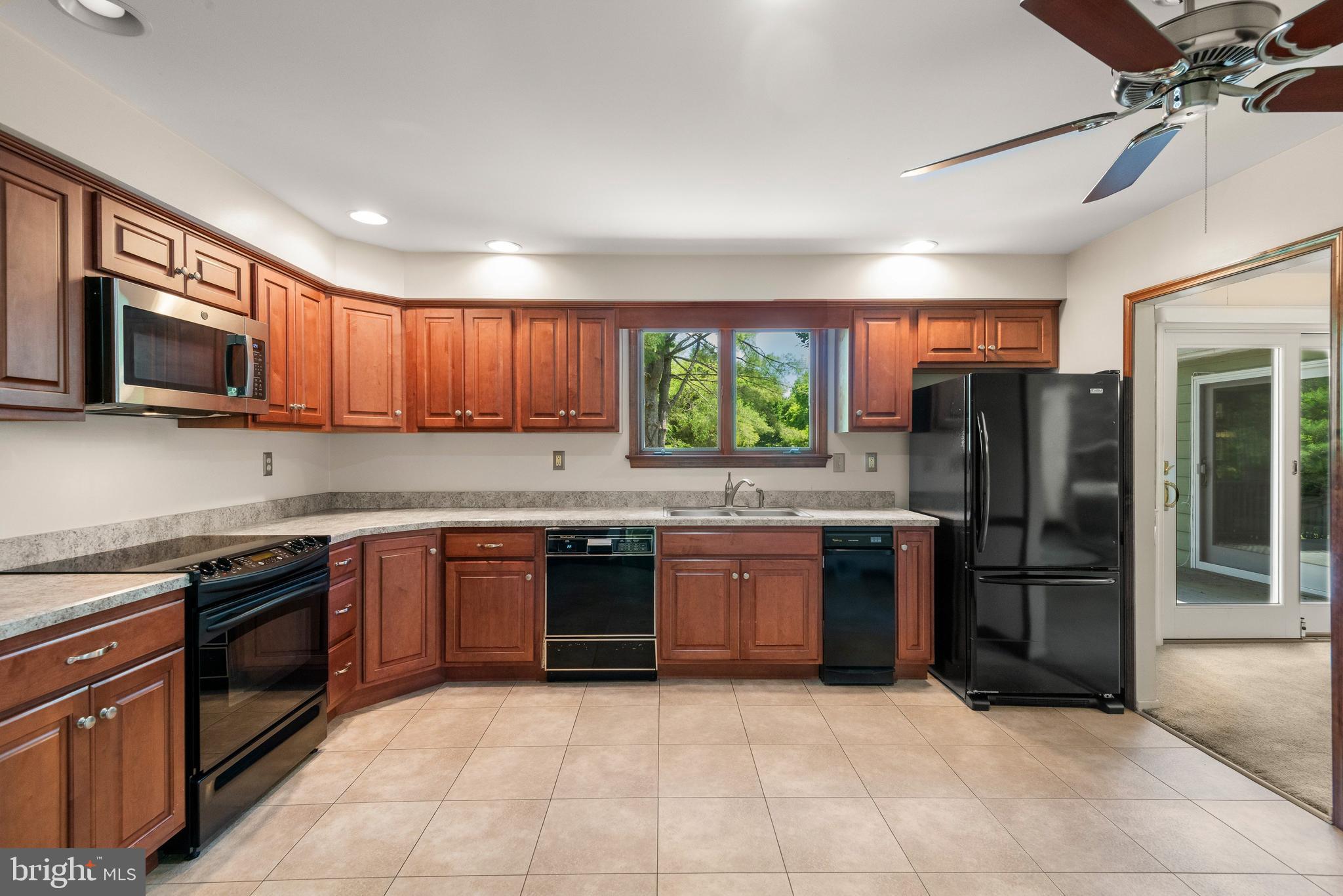 108 Sheeder Road Phoenixville, PA 19460 - Photo 9 of 42 a large kitchen with stainless steel appliances granite countertop a stove sink and refrigerator