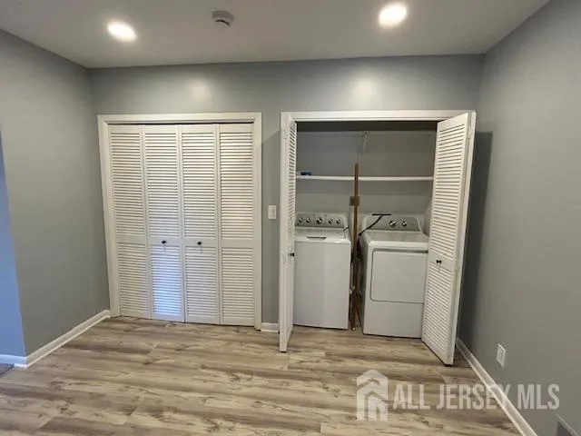 a view of storage and utility room with closet