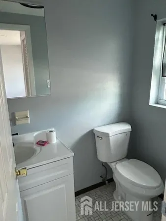 a bathroom with a toilet and a sink