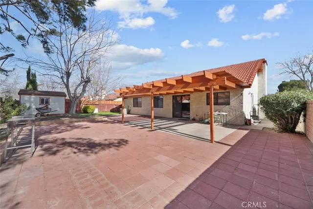 a backyard of a house with a tree