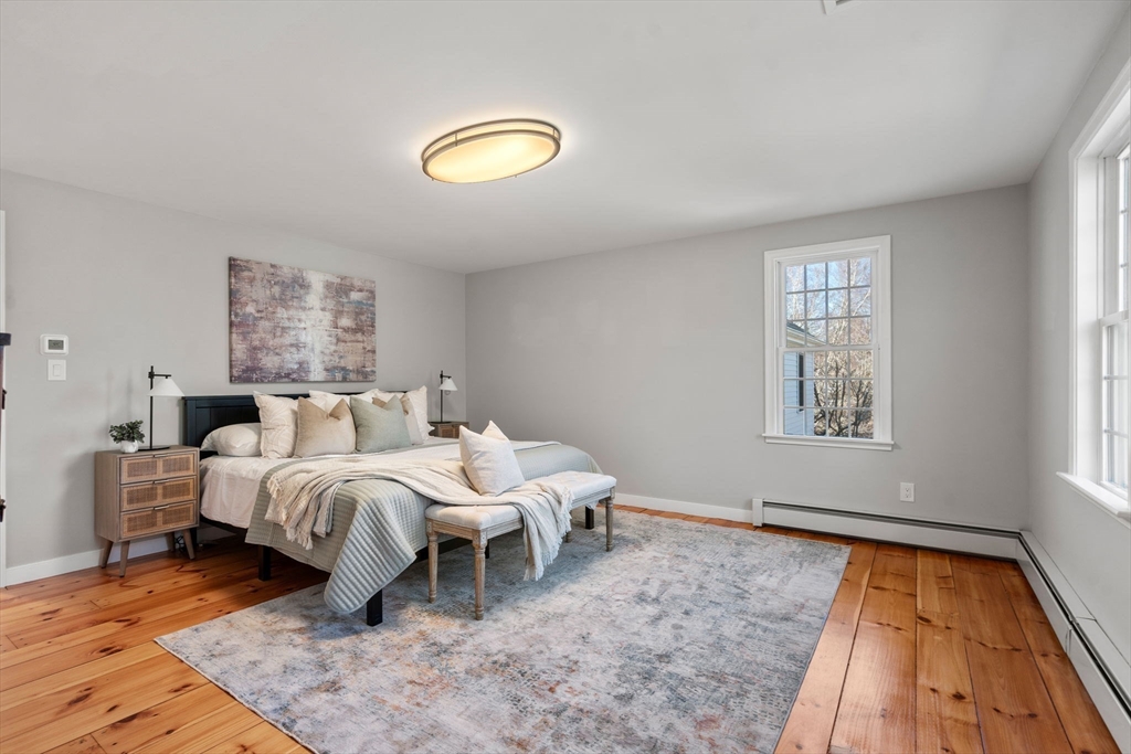 25 Charles Street Hingham, MA 02043 - Photo 16 of 32 a bed room with a bed and a window